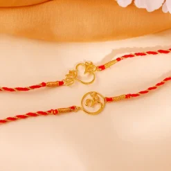 Golden Sacred Bloom Rakhi Combo (Set of 2)